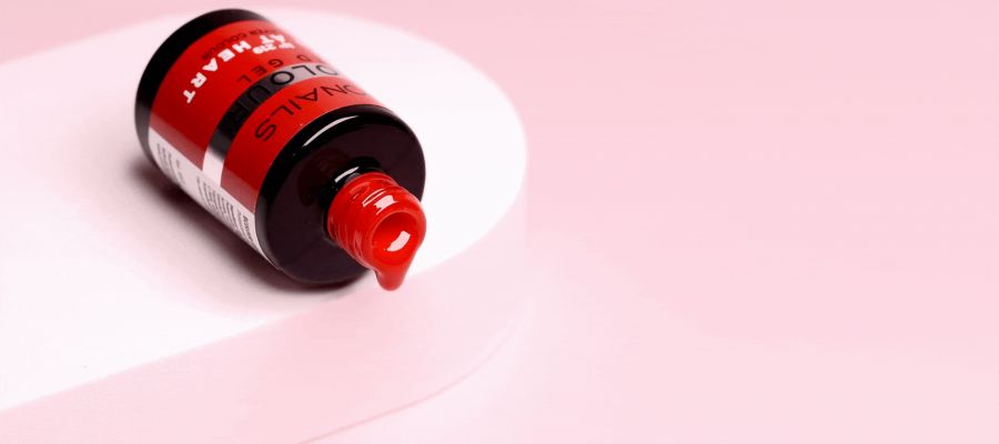 Horizontal image of a BCOLOUR gel nail bottle with gel dripping out